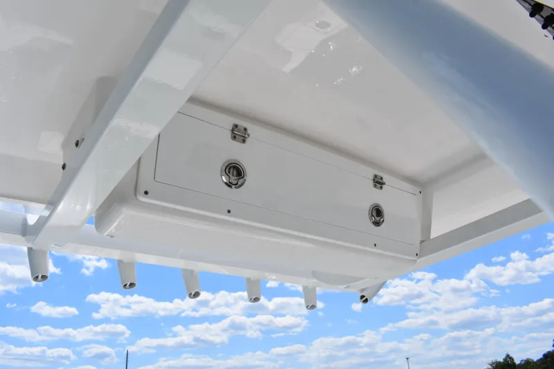 Slide: The Image of 2026 Sea Fox 248 Commander boat storage compartment under clear blue sky. - 16
