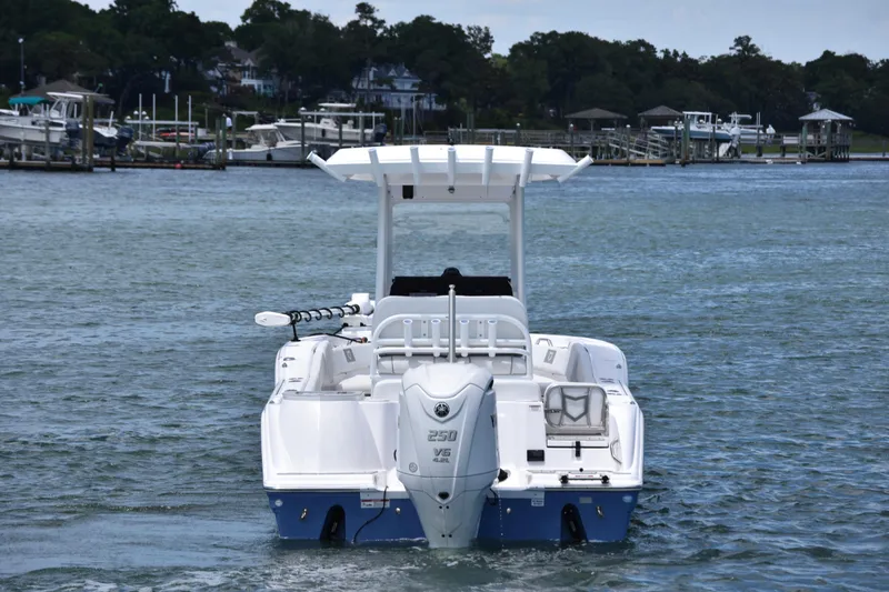 Slide: The Image of 2026 Sea Fox 248 Commander boat on water, rear view with outboard motor. - 3