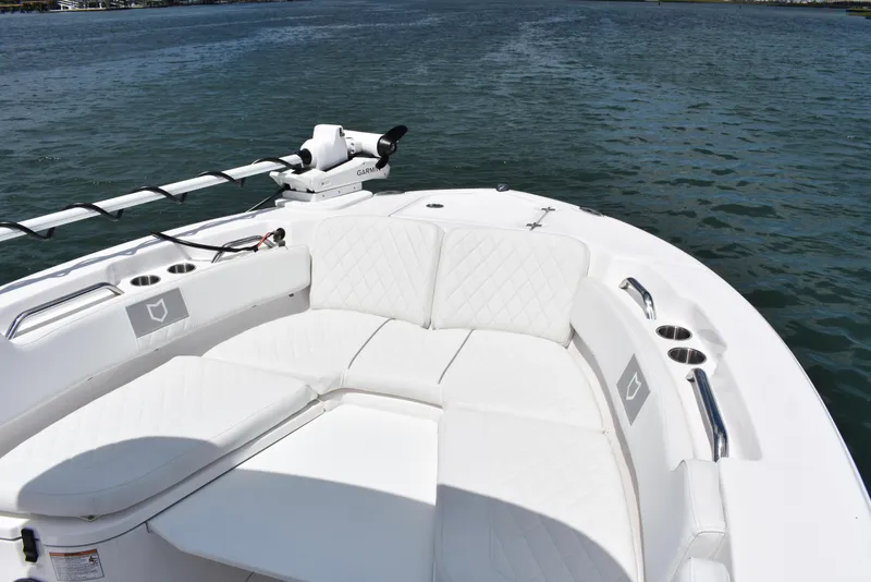 Slide: The Image of Bow seating area of 2026 Sea Fox 248 Commander boat on water. - 6