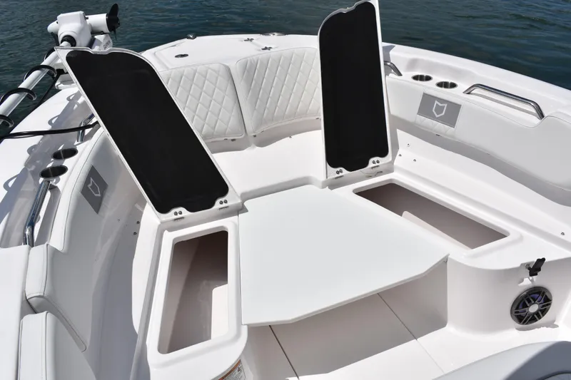 Slide: The Image of 2026 Sea Fox 248 Commander boat interior with open storage compartments and cushioned seating. - 7