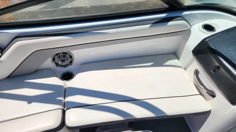 Slide: The Image of Interior of a 2016 Yamaha AR192 boat with white seating. - 19