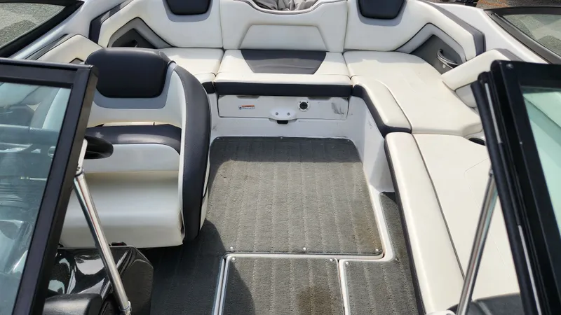 Slide: The Image of Interior of a 2016 Yamaha AR192 boat with gray and white seating. - 26