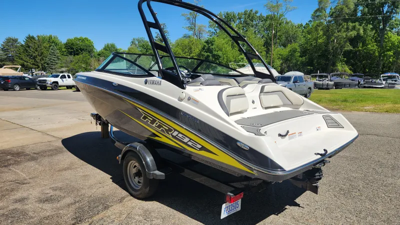 Slide: The Image of 2016 Yamaha AR192 boat parked outdoors on a trailer. - 32