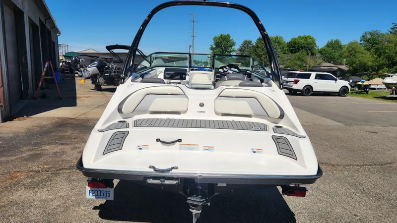 Slide: The Image of Rear view of a 2016 Yamaha AR192 boat in a parking area. - 33