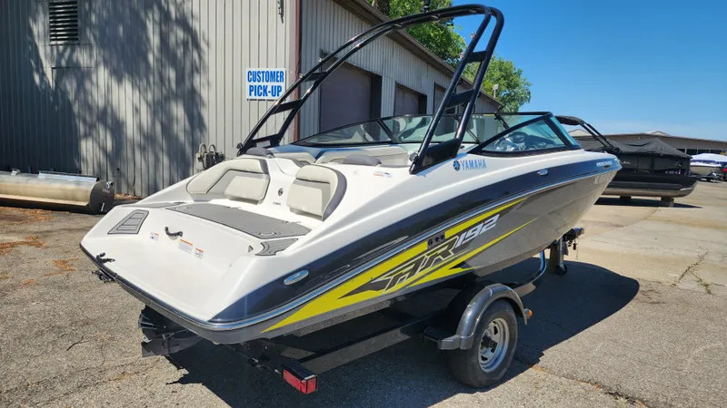Slide: The Image of 2016 Yamaha AR192 boat on trailer outside warehouse. - 34