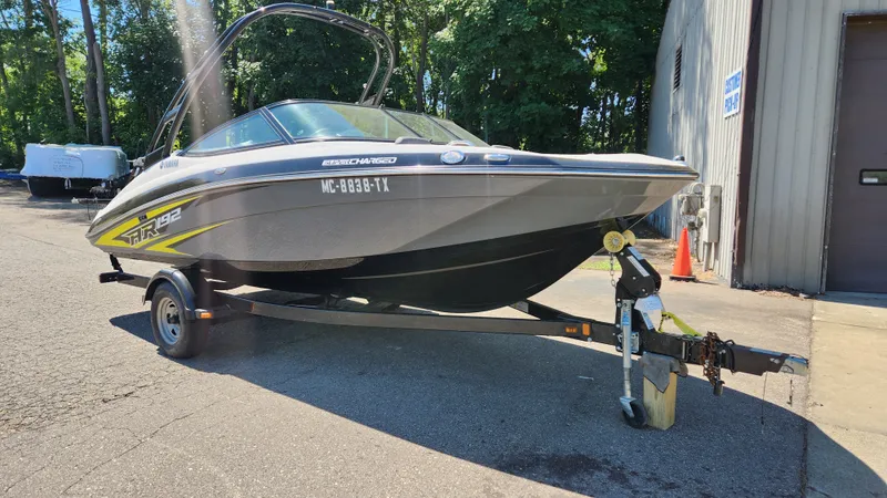 Slide: The Image of 2016 Yamaha AR192 boat on trailer outside building. - 35