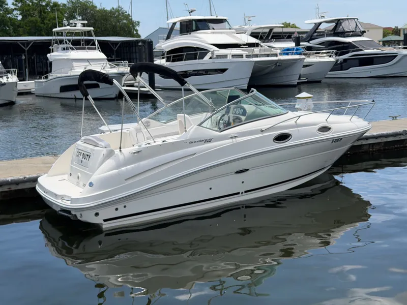 Slide: The Image of 2011 Sea Ray 240 Sundancer boat docked at marina. - 1