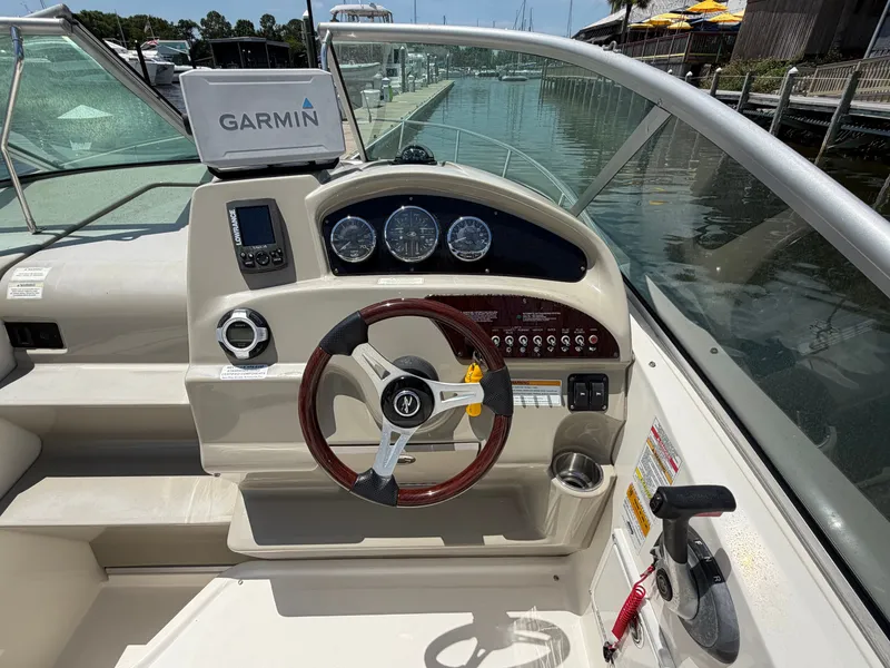 Slide: The Image of 2011 Sea Ray 240 Sundancer helm with Garmin navigation system. - 14