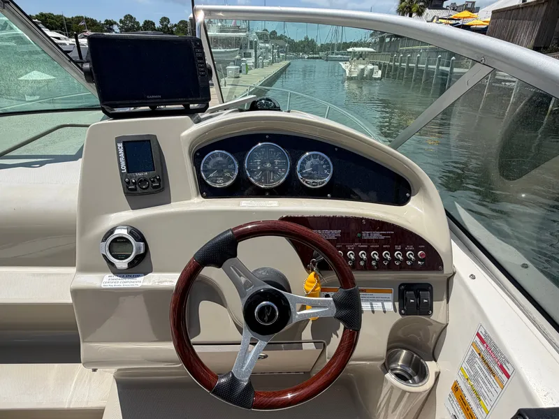 Slide: The Image of Sea Ray 240 Sundancer 2011 helm with navigation instruments. - 22
