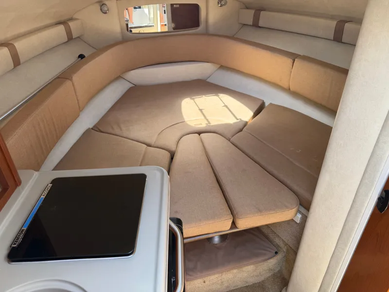 Slide: The Image of Interior of 2011 Sea Ray 240 Sundancer with sleeping area. - 23