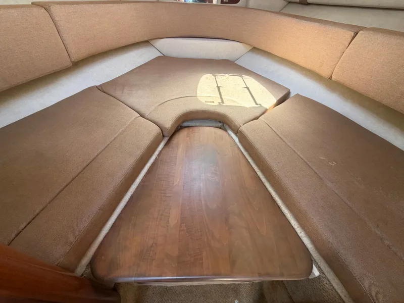 Slide: The Image of Interior of 2011 Sea Ray 240 Sundancer with brown upholstery. - 34