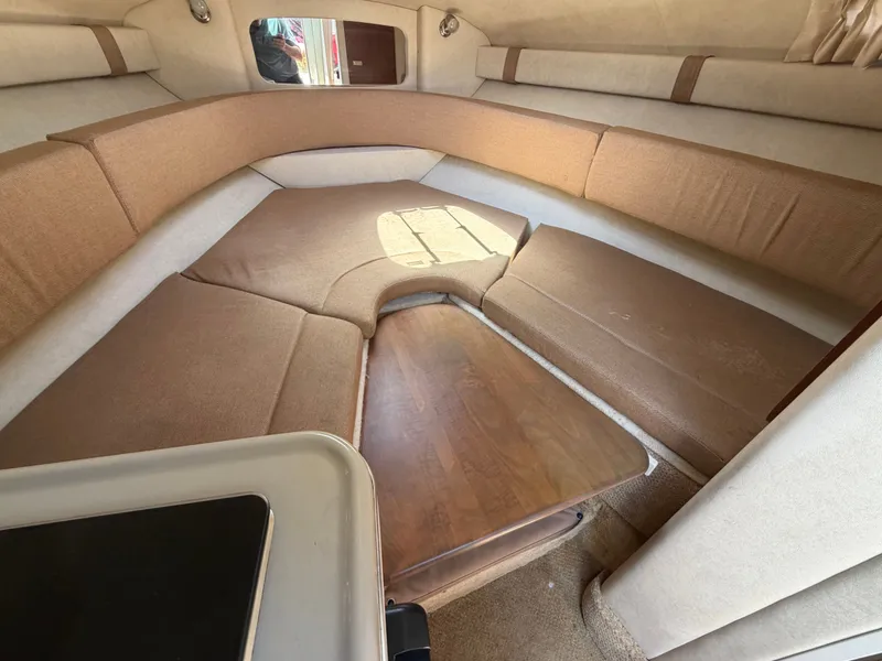 Slide: The Image of Interior of 2011 Sea Ray 240 Sundancer with seating area. - 35