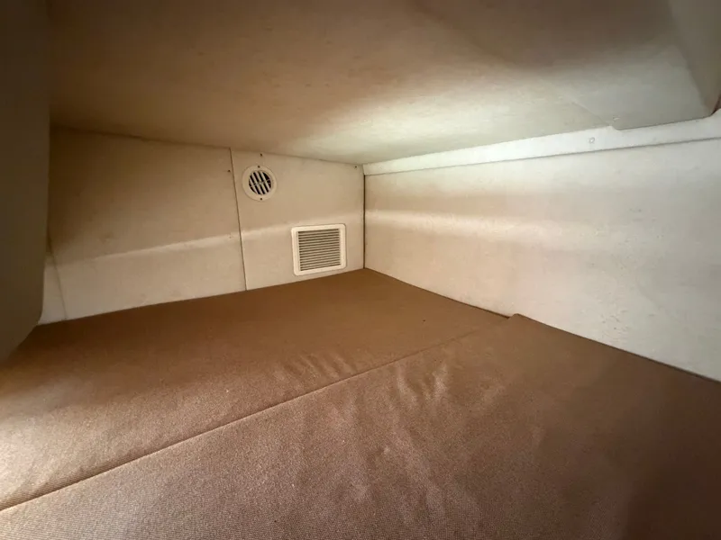 Slide: The Image of Interior of 2011 Sea Ray 240 Sundancer, beige upholstery. - 37