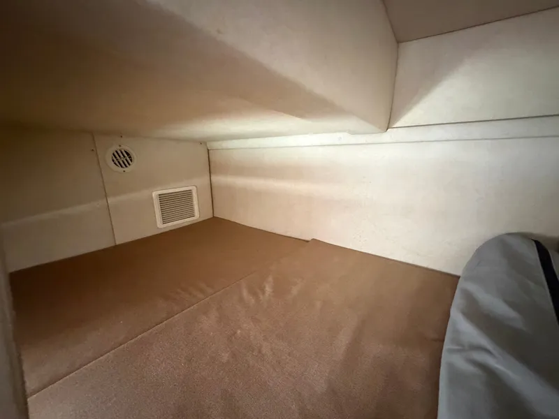 Slide: The Image of Interior of 2011 Sea Ray 240 Sundancer, beige upholstery. - 38