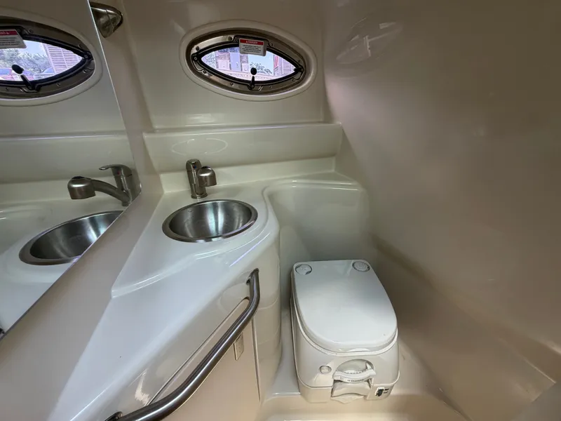 Slide: The Image of Interior of 2011 Sea Ray 240 Sundancer with sink and toilet. - 40