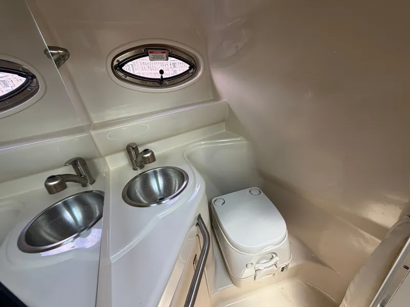 Slide: The Image of Interior of 2011 Sea Ray 240 Sundancer with sink and toilet. - 41