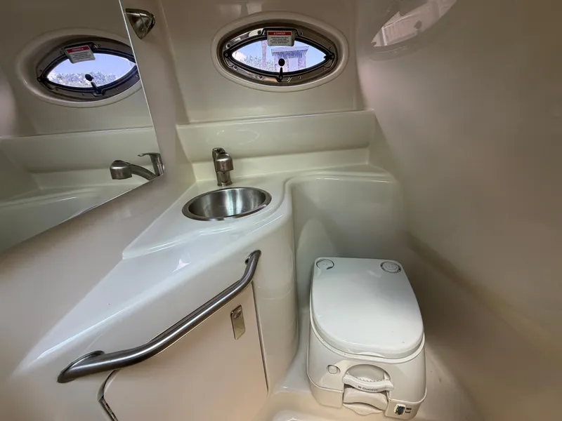Slide: The Image of Interior of 2011 Sea Ray 240 Sundancer with sink and toilet. - 42