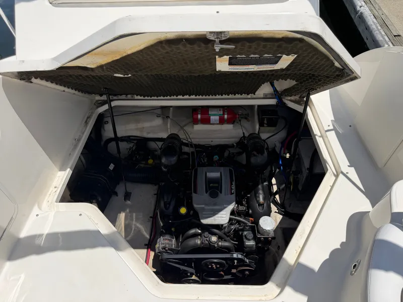 Slide: The Image of Engine compartment of a 2011 Sea Ray 240 Sundancer boat. - 43
