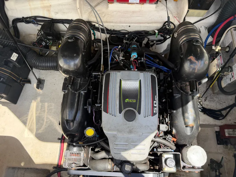 Slide: The Image of Engine compartment of a 2011 Sea Ray 240 Sundancer boat. - 44