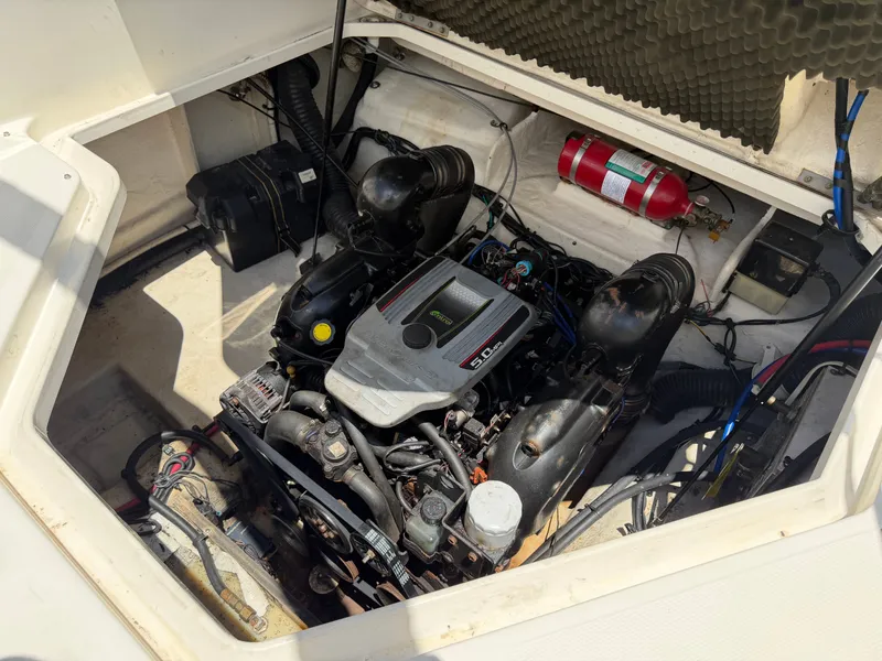 Slide: The Image of Engine compartment of a 2011 Sea Ray 240 Sundancer boat. - 45