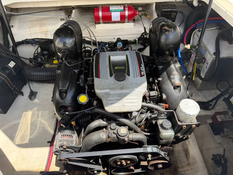 Slide: The Image of Engine compartment of a 2011 Sea Ray 240 Sundancer with MerCruiser 5.0L engine. - 47