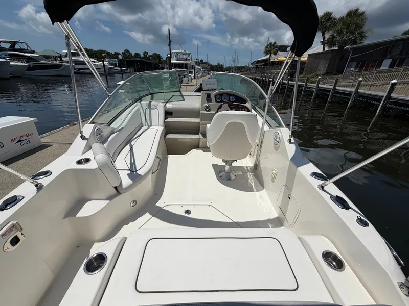 Slide: The Image of Interior view of a 2011 Sea Ray 240 Sundancer at the dock. - 7