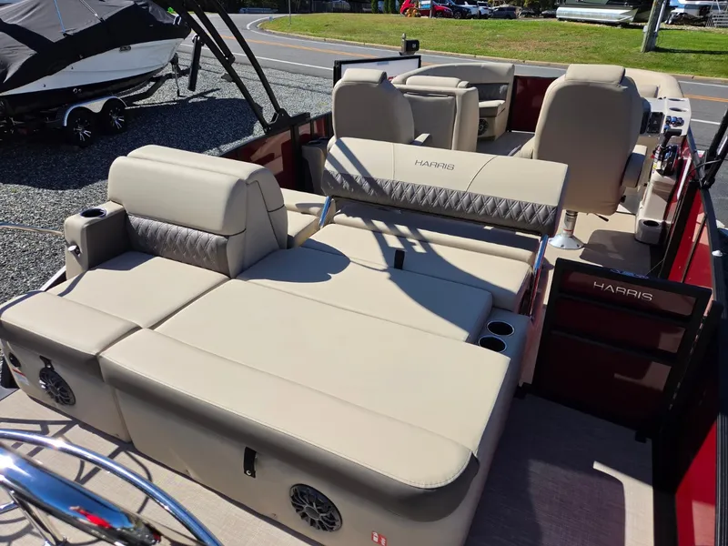 Slide: The Image of The image shows the deck of a 2027 Harris Cruiser 210 with beige upholstery and speakers. - 8
