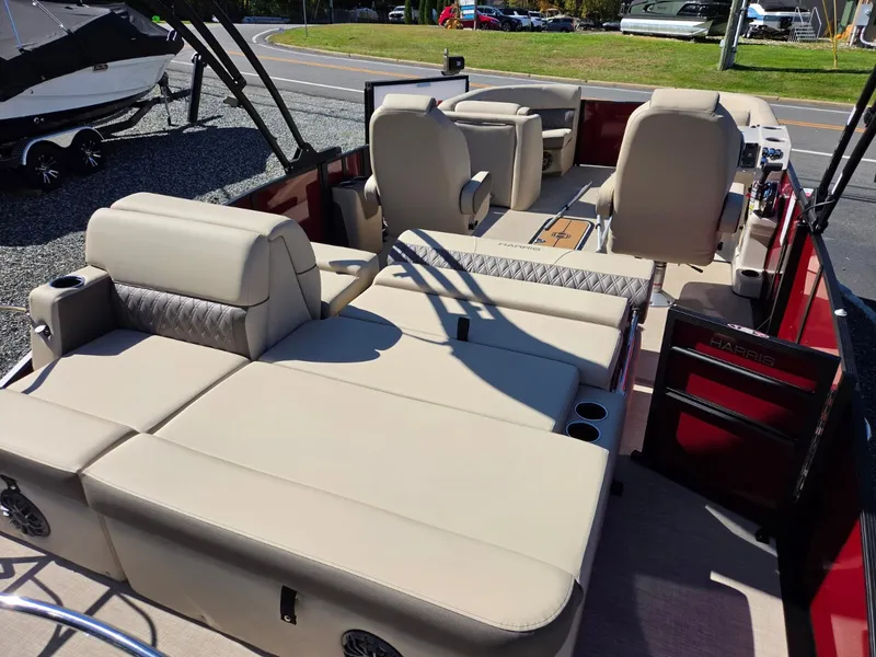 Slide: The Image of The image shows the spacious deck of a 2027 Harris Cruiser 210 with beige seating. - 9
