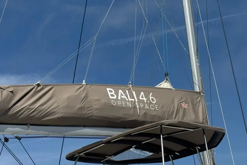 Slide: The Image of Sail of a 2023 Bali 4.6 catamaran against a clear blue sky. - 10
