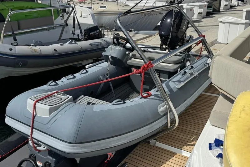 Slide: The Image of 2023 Bali 4.6 inflatable boat docked with outboard motor. - 14