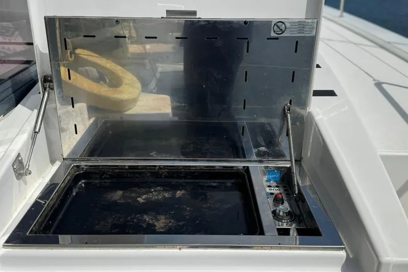 Slide: The Image of Outdoor grill on a 2023 Bali 4.6 yacht, featuring a sleek stainless steel design. - 15