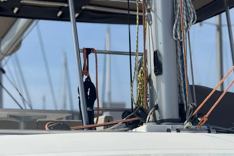 Slide: The Image of Close-up of a 2023 Bali 4.6 sailboat mast with ropes and rigging. - 22
