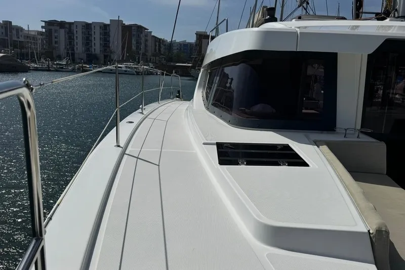 Slide: The Image of Modern 2023 Bali 4.6 yacht docked in a marina under clear skies. - 23