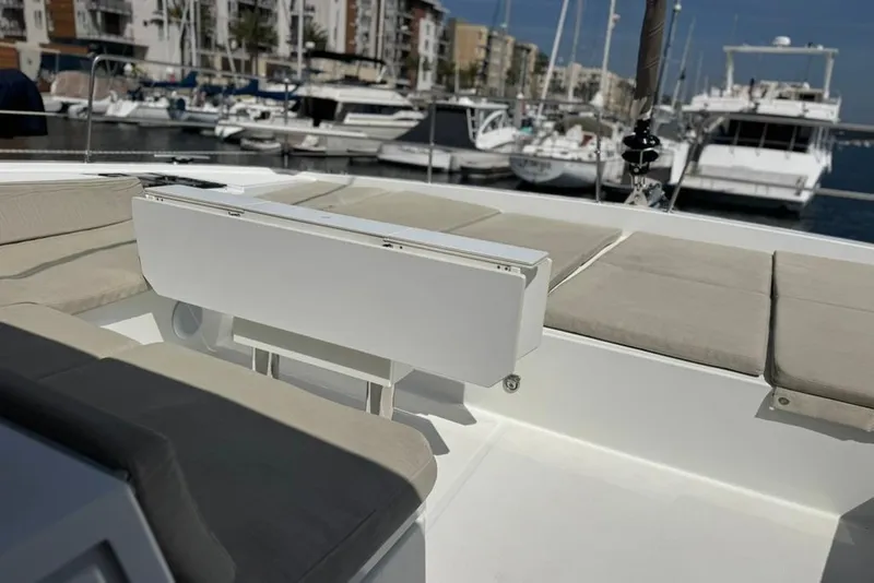 Slide: The Image of Luxurious 2023 Bali 4.6 yacht interior with comfortable seating in a marina setting. - 24