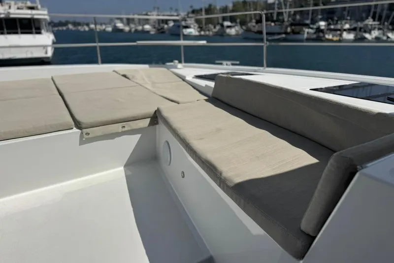 Slide: The Image of Luxurious seating area on a 2023 Bali 4.6 yacht, docked in a marina. - 25