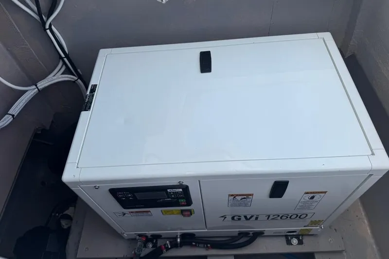 Slide: The Image of 2023 Bali 4.6 GVi 12600 generator in a compartment with cables. - 26