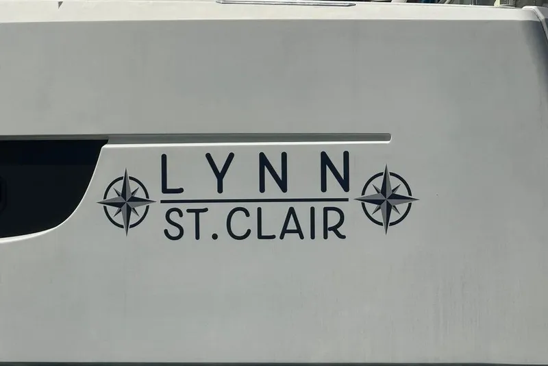 Slide: The Image of Side view of 2023 Bali 4.6 yacht with "LYNN ST. CLAIR" name and compass design. - 3