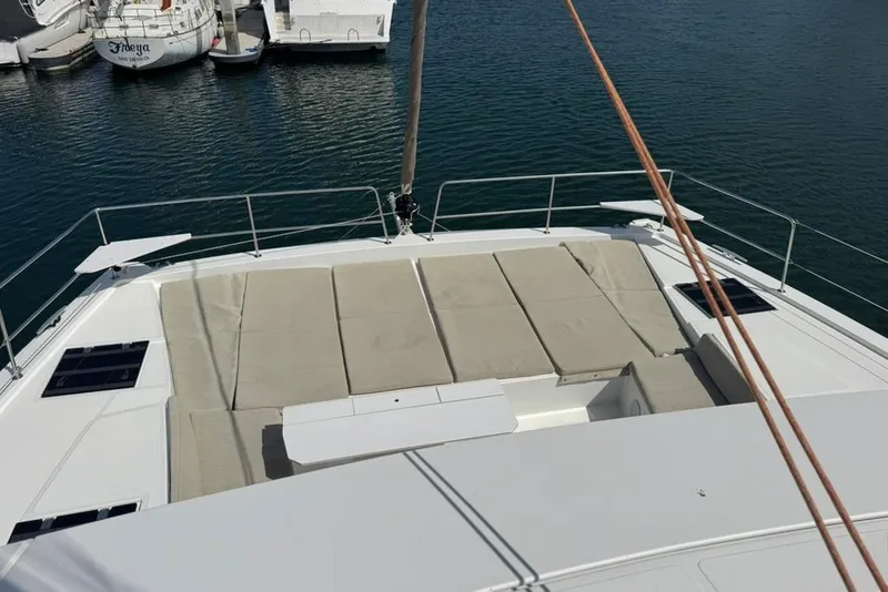 Slide: The Image of 2023 Bali 4.6 yacht with spacious deck and sunbathing area in marina. - 33
