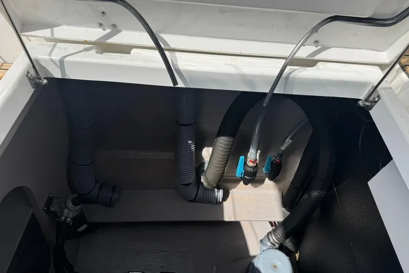 Slide: The Image of Interior view of 2023 Bali 4.6 boat showing hoses and fittings. - 41