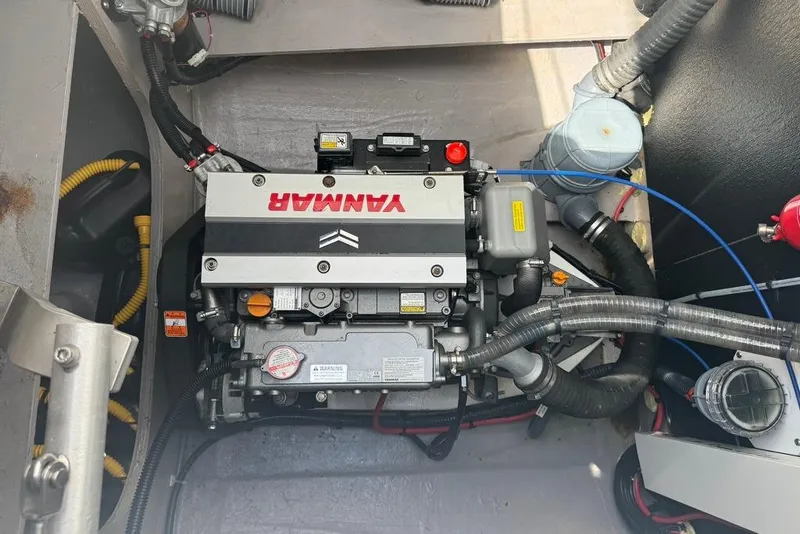 Slide: The Image of Engine compartment of a 2023 Bali 4.6 boat featuring a Yanmar engine. - 42