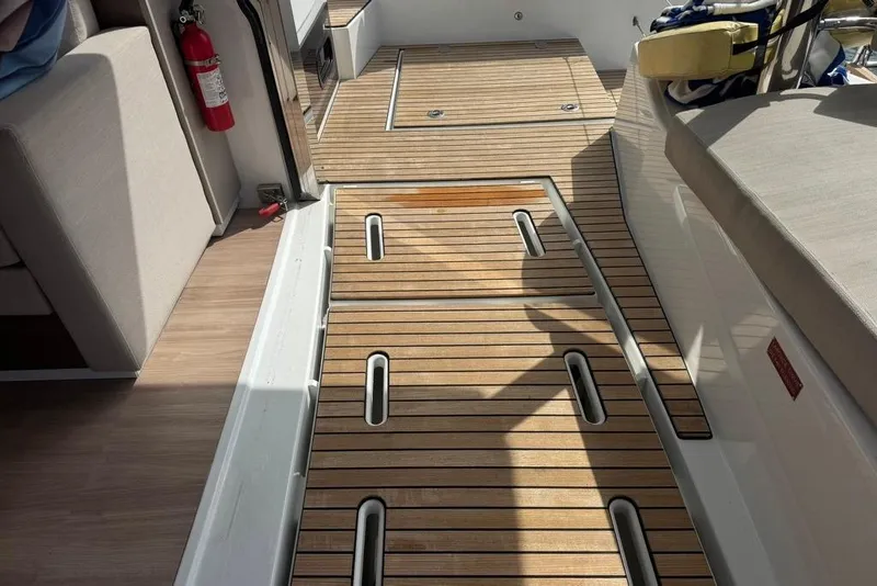 Slide: The Image of Modern 2023 Bali 4.6 yacht interior with sleek wooden flooring and comfortable seating. - 49