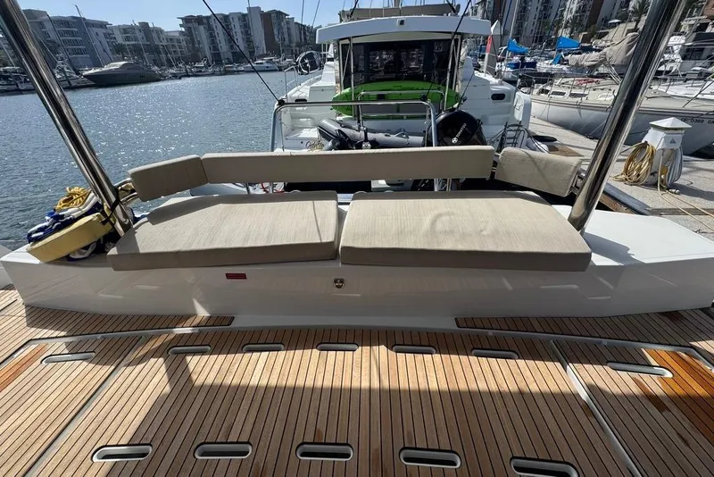 Slide: The Image of 2023 Bali 4.6 yacht with cushioned seating at marina, showcasing luxury and comfort. - 51
