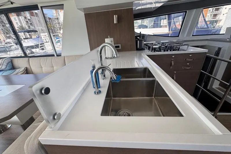Slide: The Image of Modern kitchen interior on a 2023 Bali 4.6 yacht, featuring a sleek sink and countertop. - 57