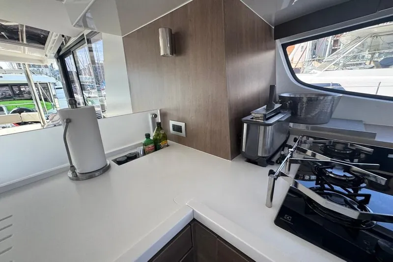 Slide: The Image of Modern kitchen on 2023 Bali 4.6 yacht with stove, toaster, and window view. - 59