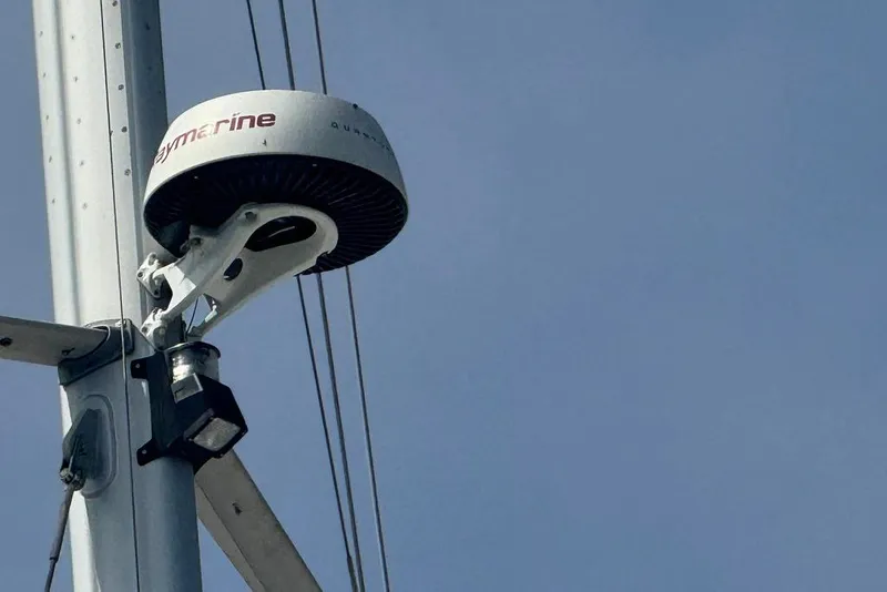 Slide: The Image of Radar equipment mounted on a Bali 4.6 sailboat mast, 2023 model, under clear blue sky. - 6