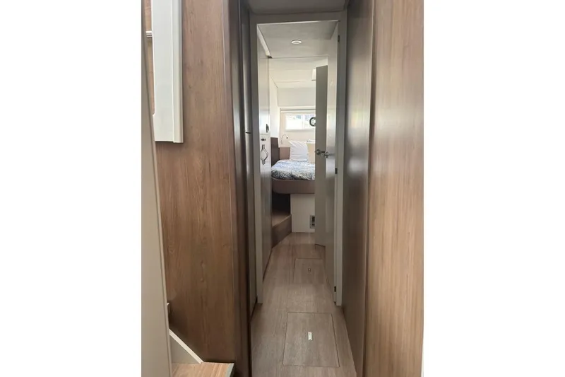 Slide: The Image of Interior hallway of 2023 Bali 4.6 yacht, leading to a cozy bedroom. - 68