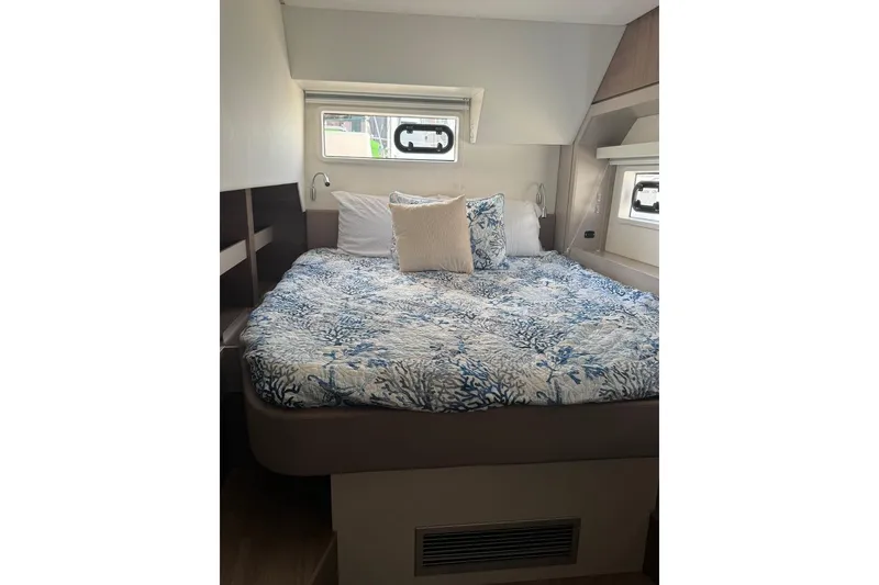 Slide: The Image of Cozy bedroom in 2023 Bali 4.6 yacht with nautical-themed bedding. - 69