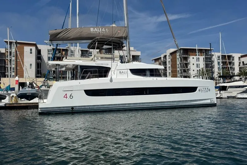 Slide: The Image of 2023 Bali 4.6 catamaran docked in marina, modern design, clear blue sky. - 7