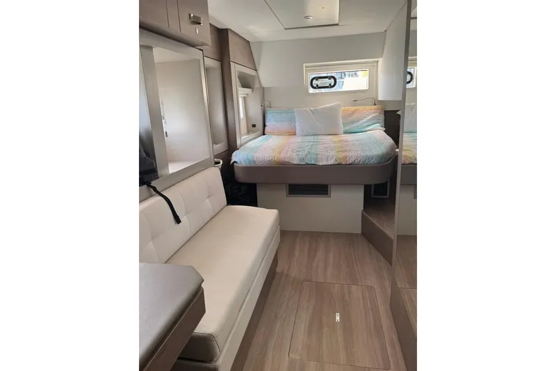 Slide: The Image of Interior of 2023 Bali 4.6 yacht featuring cozy bed and seating area. - 74
