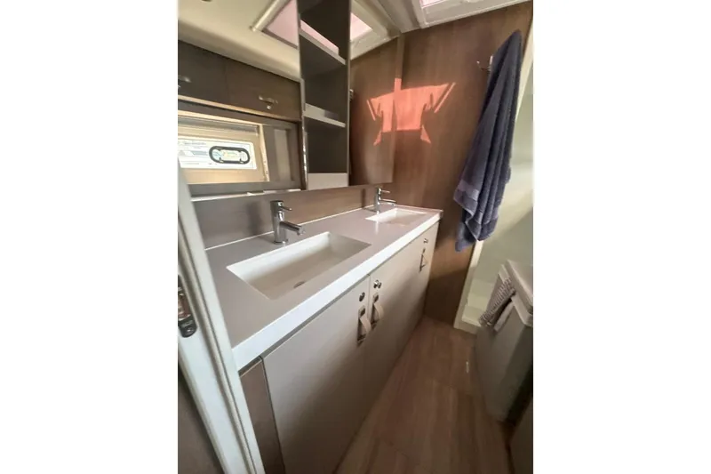 Slide: The Image of Modern bathroom interior in 2023 Bali 4.6 model, featuring dual sinks and sleek cabinetry. - 75